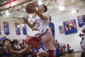 Jeannette's Jackson Pruitt leaps for a layup shot against Leechburg during WPIAL boys' basketball at Jeannette High School on Tuesday, Jan. 30, 2018.