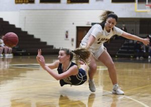 Ringgold's Hope Martin saves the ball away from Greensburg Salem's Nikki Mellinger Monday, Jan. 29, 2018 at Greensburg Salem High School.