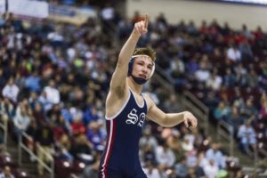 Shaler's Ryan Sullivan points to the crowd after defeating West Chester Henderson's Killian Delaney in the 113-pound 3A championship final during the PIAA state wrestling championship Saturday, March 10, 2018 at the Giant Center in Hershey.