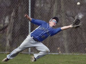 Hempfield's Luke Hudson makes a lunging catch in left field during a game against Norwin Thurday, April 12, 2018, at Norwin High School.