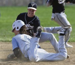 Valley's Dan Antonacci tags out Burrell's Tyler Mock on the steal attempt in the fourth inning Wednesday April 18, 2018 at Valley High School.