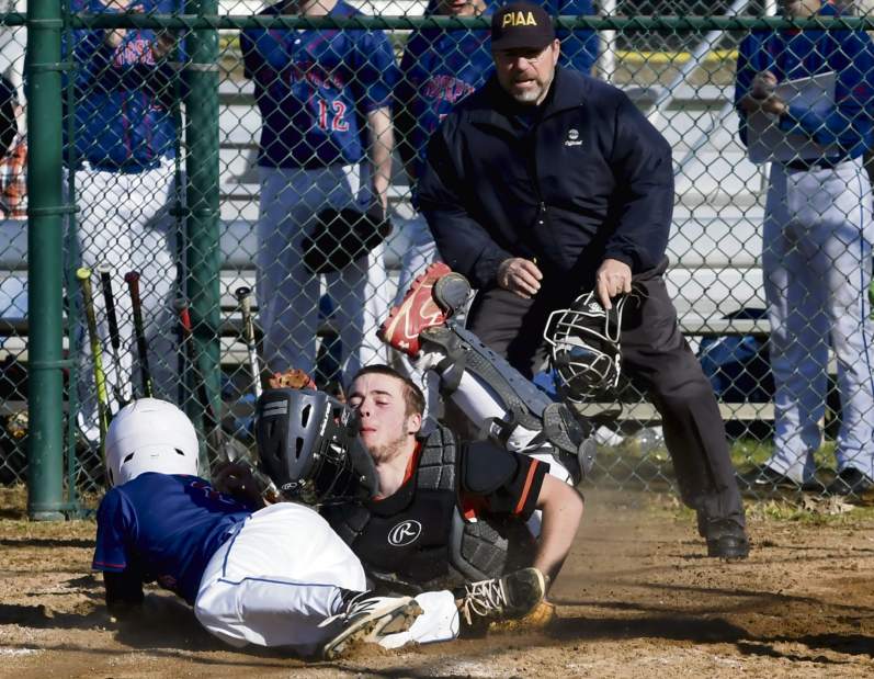 St. Joseph's Dominic Fellowes (6) collides with Sprigdale catcher Bill Vokes during their game Friday, April 20, 2018, at Springdale. St. Joseph won 17-1.