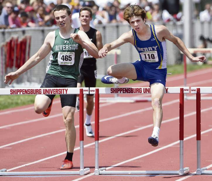 Derry's Shawn Broadway competes in the Class AA boys 300 meter hurdle final next to Riverside's Calvin Wetzel during the PIAA track and field state championships Saturday, May 26, 2018, at Shippensburg University. Broadway finished in second place.