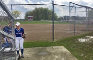Mt. Pleasant senior Alyssa Keslar gathers her gear after a storm rained out the Vikings' game with Yough Thursday, May 10, 2018, at Mt. Pleasant High School.