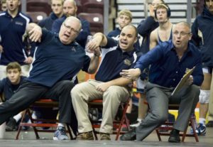 Kiski Area head coach Chris Heater (right) and assistant coaches Chuck Tursky (left) and Matt Kiebler react during their 35-31 comeback victory over Cumberland Valley in the opening round of the PIAA Class AAA team wrestling tournament at the Giant Center on Thursday, Feb. 11, 2016, in Hershey.