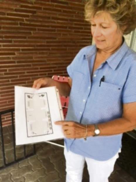 Former Greensburg Salem athletic director Lynn Jobe displays the design of a walkway to be constructed at Offutt Field on June 26, 2018, in Greensburg.