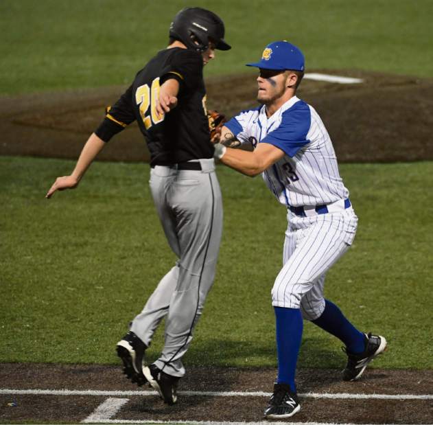 Canon-McMillan's Ian Hess tags out North Allegheny's C.J. Weller during the WPIAL 6-A Baseball Championship Wednesday May 30, 2018 at Wild Things Park.