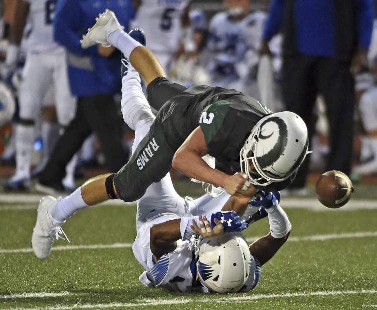 Pine Richland's Luke Meckler breaks up a pass intended for IMG Academy's Josh Delgado Friday, Aug. 24, 2018 at Pine Richland Stadium.