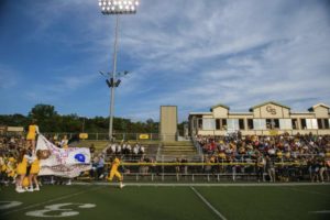 Greensburg Salem runs through the banner before the start of WPIAL football against Hempfield at Greensburg Salem's Offutt Field on Friday, Aug. 24, 2018.