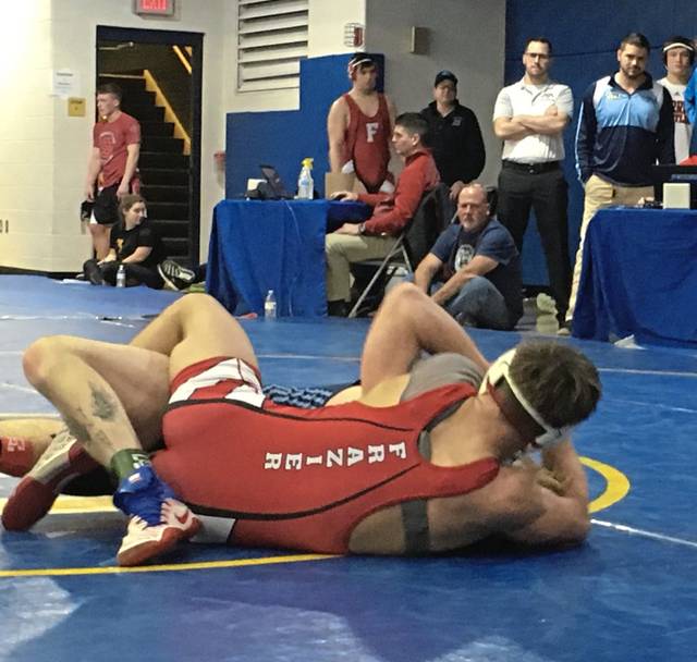 Frazier junior Thayne Lawrence picks up back points against Burrell senior Austin Mele in the Section 3-AA tournament Feb. 16, 2019, at Canon-McMillan.