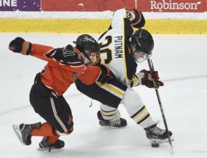 North Alleghenys Tyler Putnam battles Bethel Parks Jacob Lang for the puck during their Penguins Cup Class AAA semifinal Thursday, Mar. 14, 2019, at RMU Island Sports Center. North Allegheny won, 2-1, in double overtime.