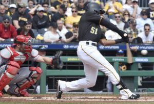 Pirates left fielder Jason Martin connects on his first Major League hit during the first inning against the Reds Saturday, April 6, 2019, at PNC Park.