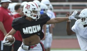 Moon running back Jamal Littlejohn works out during practice on Wednesday, Aug. 14, 2019.