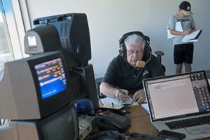 Roger Huston calls a race at The Meadows in 2014.