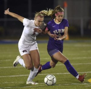 Plums Emily Kirkpatrick battles West Alleghenys Taranto Mackenzie for the ball during their WPIAL Class 3A semifinal Monday, Oct. 28, 2019, at Mars Area High School.