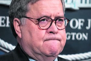 Attorney General William Barr speaks to reporters at the Justice Department in Washington on Jan. 13, 2020.