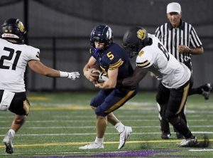 North Alleghenys Khalil Dinkins tackles Central Catholics Anderson Cynkar for a loss during the first quarter of their game on Friday, Sept. 25, 2020, at Graham Field in Wilkinsburg.