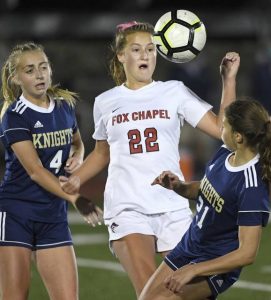 Fox Chapel’s Sydney Schutzman works between Norwin’s Alyssa Aquilio (4) and Evelyn Moore during their game on Monday, Oct. 5, 2020, at Norwin.