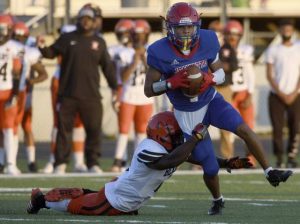 Jeannette’s James Sanders fights through a tackle attempt by Clairton’s Brooklyn Cannon for a first-quarter touchdown Friday, Sept. 11, 2020, at McKee Stadium in Jeannette.