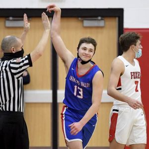 Chartiers Valley’s Carter Mastovich celebrates a 3-pointer next to Fox Chapel’s Eli Yofan during their game on Jan. 9.