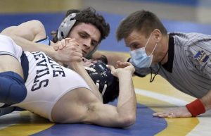 Burrells Damien Barr pins Burgettstowns DJ Slovick at 152 pounds during the WPIAL Class AA team championship match on Saturday, Feb. 13, 2021, at Canon-McMillan High School.