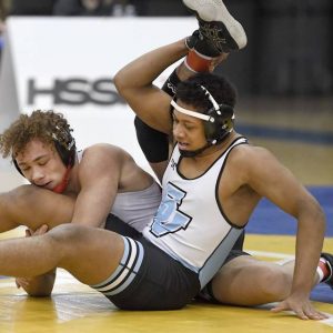 Waynesburg’s Darnell Johnson works against Seneca Valley’s Manuel Santos at 172 pounds during the WPIAL Class AAA team championship match on Feb. 13, 2021, at Canon-McMillan High School.