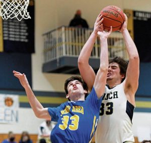 Knoch’s Jake Schiedt keeps the ball from Derry’s Sam Jones on Tuesday, Feb. 23, 2021 at Knoch High School.