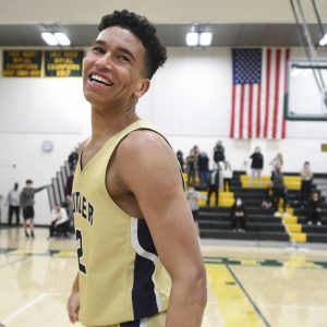 Butler’s Devin Carney smiles as he leaves the court after hitting the winning 3-pointer in overtime of a WPIAL Class 6A quarterfinal against Penn-Trafford on March 5.
