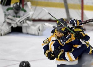 Mt. Lebanon’s Nolan Lynam and Baeddan Pollett celebrate with Marcus Simmonds after Simmonds’ goal against Pine-Richland in the third period during the Penguins Cup AAA semifinal on Monday, April 12, 2021, at Robert Morris University Island Sports Center.