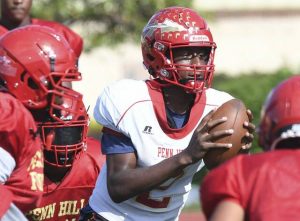 Penn Hills quarterback Julian Dugger looks to throw during practice Aug. 13.