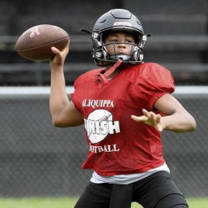 Aliquippa quarterback Quentin Goode throws a pass during practice on Aug. 17, 2021, in Aliquippa.