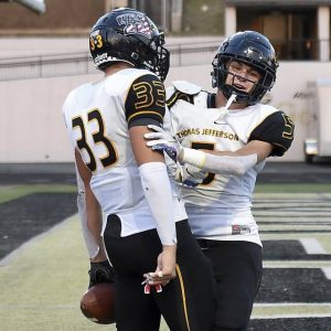 Thomas Jefferson’s Jordan Mayer (33) celebrates his touchdown catch with McClain Flinn during the second quarter against Gateway last Friday.