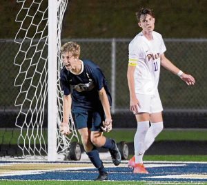 Franklin Regional’s Jake Zimmerman celebrates after scoring the winning goal in overtime next to Plum’s Kyle Ryan on Tuesday, Sept. 7, 2021, in Murrysville.