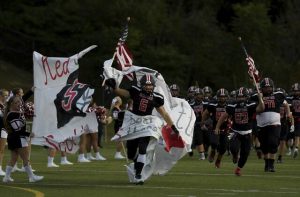 Southmoreland’s Anthony Govern leads his team on the field before kickoff against Mt. Pleasant last season.