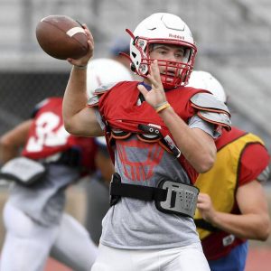 Chartiers Valley quarterback Anthony Mackey throws a pass during practice on Aug. 17, 2021, in Collier.
