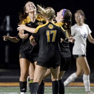 North Alleghenys Abby Stager (left) celebrates with teammates after scoring the Tigers first goal against Seneca Valley on Tuesday, Sept. 14, 2021, in McCandless. NA won, 2-0.