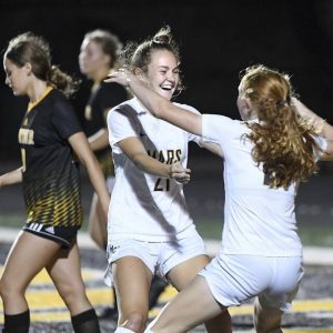 Mars’ Aly Cooper (21) celebrates her goal with Piper Coffield during their game against Montour on Thursday, Sept. 16, 2021, in Robinson. Mars won, 1-0.