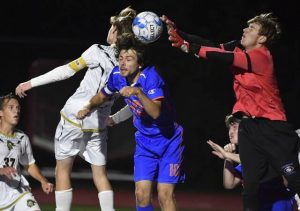 Knocks Caleb Oskin fights for the ball with Armstrongs Nolan Hielman and goalie Caden Smail on Wednesday, Sept. 29, 2021 at Armstrong Stadium.