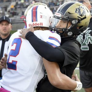 Belle Vernon’s Devin Whitlock hugs Laurel Highlands’ Rodney Gallagher before their game on Friday, Oct. 1, 2021, James Weir Stadium in Rostraver.