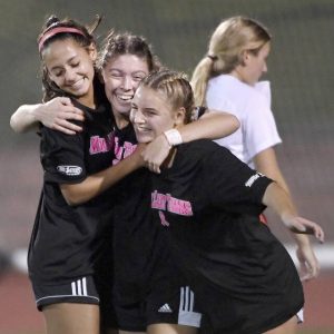 Moon’s Hailey Longwell (center) celebrates her goal with teammates during their game against Peters Twp. on Monday, Oct. 4, 2021, at Moon Area High School. Moon won, 1-0.