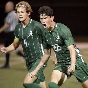 Allderdice’s Ezra Dubowitz (22) celebrates his goal with Ben Beale during their game against Penn-Trafford on Tuesday, Oct. 5, 2021, at Couples Stadium on the South Side.