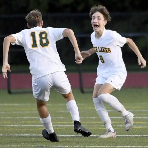 Deer Lakes’ Ruger Beer (8) celebrates his goal with Michael Butler during their game against Shady Side Academy on Wednesday, Oct. 13, 2021, in Fox Chapel. Deer Lakes won, 2-1.