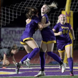 Plums Kaitlyn Killinger celebrates her hat trick goal in overtime with Ava Weleski during their game against Oakland Catholic on Thursday, Oct. 14, 2021, at Plum High School. Plum won, 3-2.