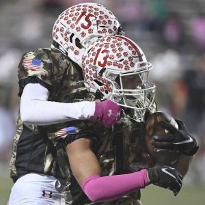 Moon’s Anthony Antoniades (13) celebrates with Elijah Davis after his long catch during their game against Upper St. Clair on Friday, Oct. 15, 2021, at Tigers Stadium in Moon.