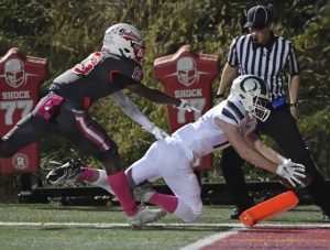 Pine-Richlands Bradford Gelly dives for the end zone past North Hills Michael Hoskey for a first-quarter touchdown Oct. 15at Martorelli Stadium.