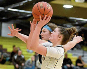 Highlands’ Katelyn Myers is fouled by Kiski Area’s Abbie Johns on Thursday at Highlands.