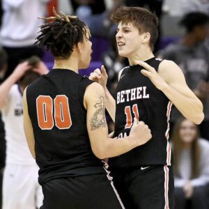 Bethel Park’s Michael Mathias (11) celebrates with Shawn Davis after scoring the game-winner in the final seconds of their game on Tuesday, Dec. 13, 2022, at Baldwin.