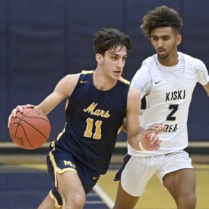 Mars Tasso Sfanos drives past Kiskis Lebryn Smith on Thursday.