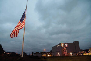 The American flag flies at half-staff at Pittsburgh Brewing Co. in East Deer in honor of Brackenridge police Chief Justin McIntire.