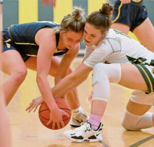 Deer Lakes Zoey Herbster and Apollo-Ridges Sophie Yard fights for a loose ball Monday.